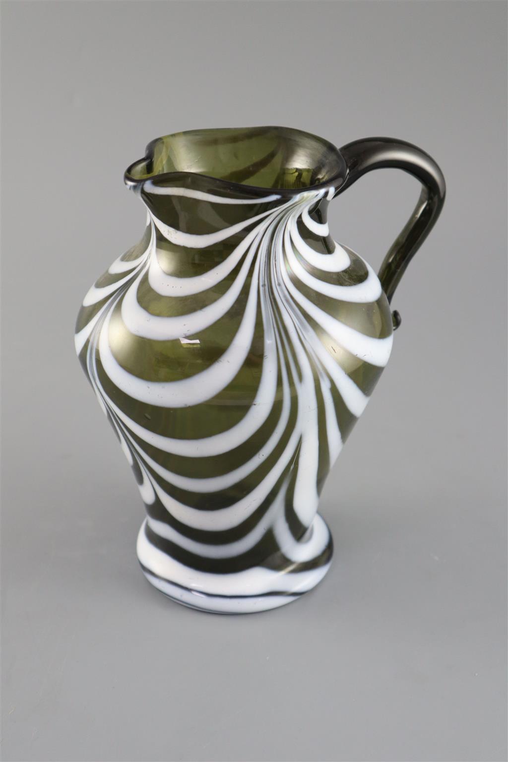 A George III green and white feather trailed glass jug, c.1800, 19cm high